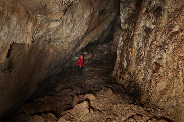 Woman explorer in a cave