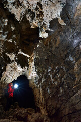 Woman explorer in a cave