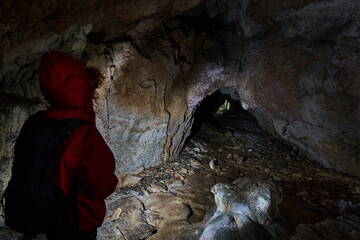 Woman explorer in a cave