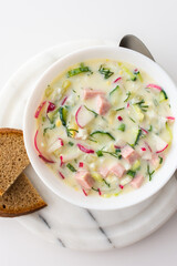 Cold soup Okroshka, soup with fresh vegetables and kefir, delicious summer traditional Ukrainian or Russian soup