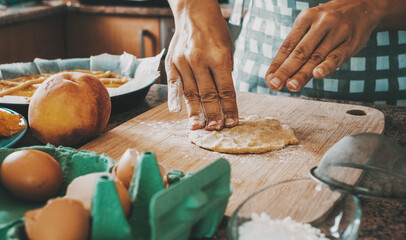 Close up of female working and cooking at home with fresh pasta making a handmade cake. Natural food lifestyle preparation concept. Woman housewife doing healthy lunch dessert with hands on the table