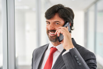 Manager or consultant uses the cell phone to make calls