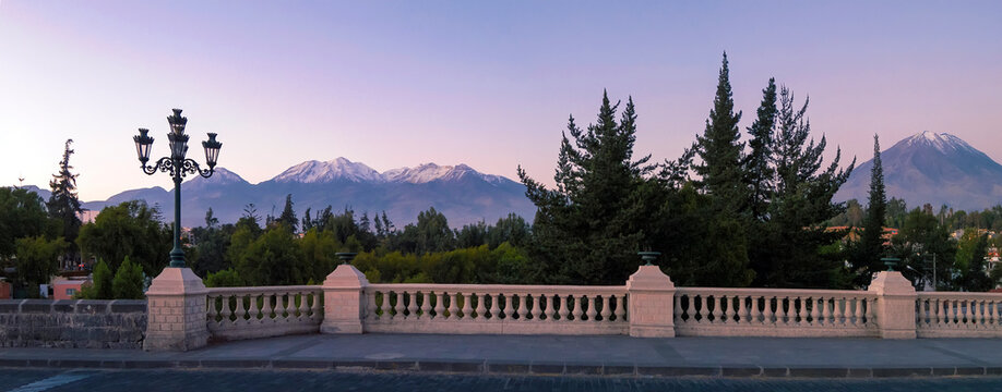 Panoramic view of the Grau bridge in Arequipa, Peru. In the background you can see the snowy Chachani and the Misti volcano
