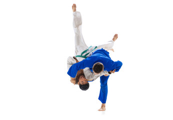 Portrait of two professional martial arts fighters training isolated over white background