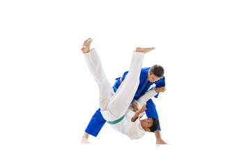 Studio shot of professional judo coach training with young man isolated over white background