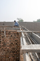 mason is working on the construction site