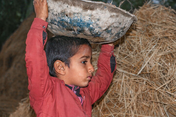 a young child is working in a cave