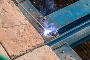 steel Construction Worker Welding Steel On Construction Site