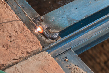 steel Construction Worker Welding Steel On Construction Site