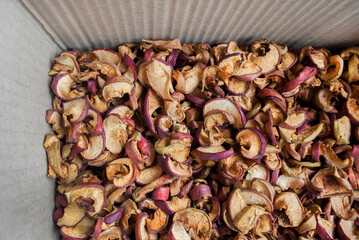 Red dried apples in a box close up. Natural healthy product