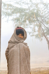 child boy wearing a shawl in very cold winter