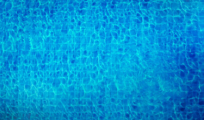 top down view of rippled clear blue water in swimming pool