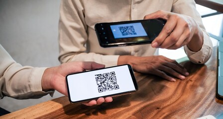 Qr code payment. Woman scanning QR code online shopping cashless technology concept.