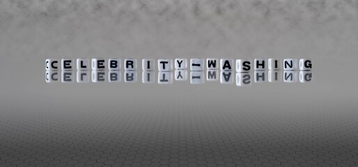 celebrity washing word or concept represented by black and white letter cubes on a grey horizon...