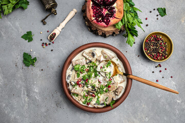 Slow cooked pork stew with mushrooms in creamy sauce served with parsley. Restaurant menu, dieting, cookbook recipe top view