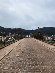 Fototapeta na wymiar Heidelberg, Germany, December 9, 2021: The Karl Theodor Bridge with Stadttor gate, Baden Wurttemberg, Germany.