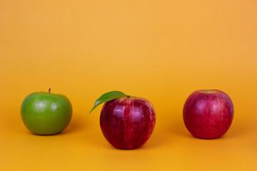 Three different apples green and red fruits isolated on yellow background. Healthy fruits concept ads. and green food for heath