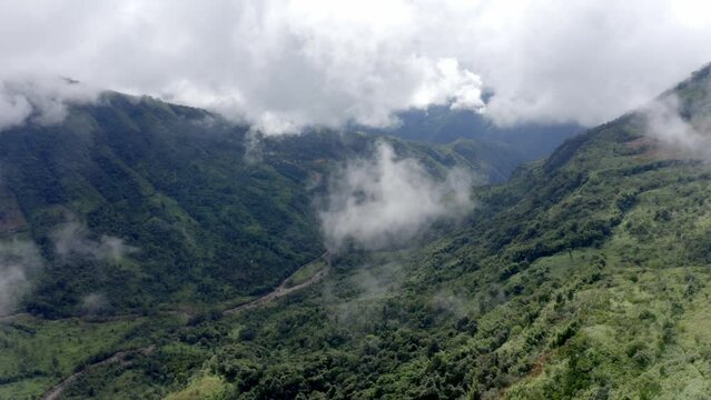 Monsoon Clouds Shrouded Over Deep Lush Forest Valleys Across Khasi Hills In Meghalaya, India. Aerial Wide Shot
