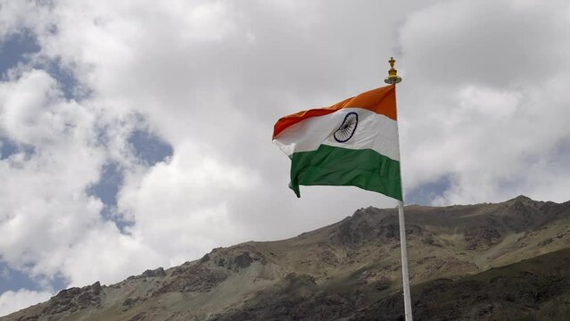 National Flag Waving Against Cloudy Sky On Kargil War Memorial In Dras, Ladakh, India. Low Angle Shot