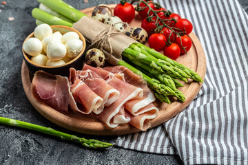 prosciutto with mozzarella cheese and cherry tomatoes. healthy food concept. Restaurant menu, dieting, cookbook recipe top view
