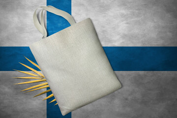 Patriotic tote bag mock up on background in colors of national flag. Finland