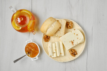 Top view of homemade curd cheese with raisin and walnut