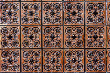 Old vintage ceramic tiles for the decoration stoves and fireplaces. Background, texture