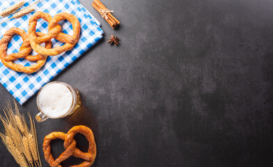 Oktoberfest festival decoration symbols made from Pretzel loaf, beer, and Bavarian white and blue...