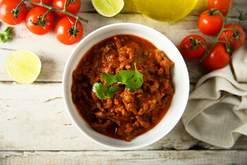 Homemade beef ragout with cilantro and lime