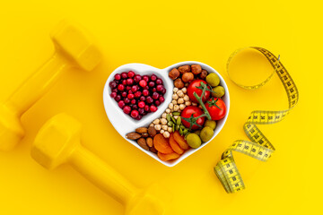 Healthy food in heart shaped dish. Healthy lifestyle and nutrition eating concept