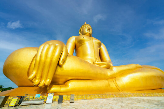 Big Buddha meditating in a temple in Ang Thong Province, Thailand. It is a destination for tourists to pay homage to the Buddha image and pray for blessing.