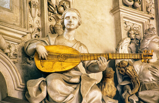 Detail in the Oratorio del Rosario di Santa Zita, Palermo, Sicily, Italy. Stucco work by Giacomo Serpotta. Woman playing lute