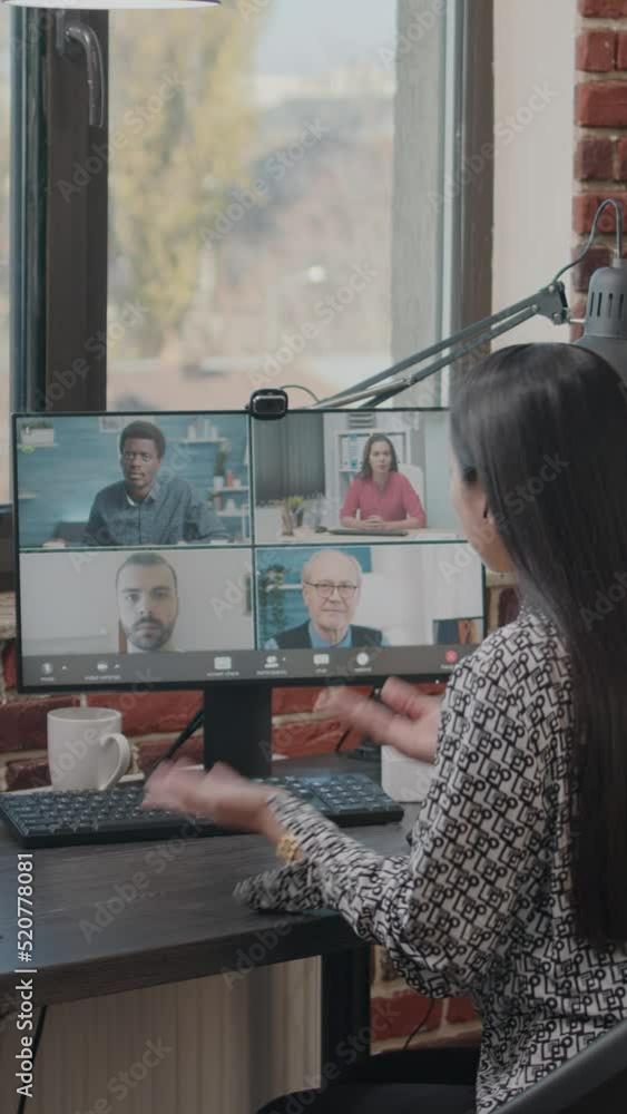 Poster vertical video: employee using video call to talk to workmates on computer. woman attending business