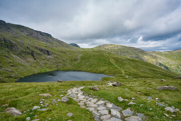 Angle Tarn, a glacial tarn in the English Lake District, high above the Langdale Valley on the way to Scafell Pike, the highest peak in England.