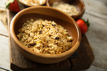Obraz na płótnie Canvas Traditional freshly made granola with ingredients