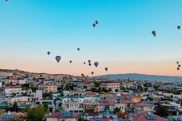 hot air balloons rising into sky, concept  of must see travel destination, bucket list trip