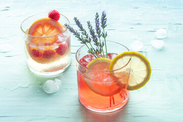Fresh summer cocktails or mocktails, cold drinks with lavender and lemon and grapefruit and...
