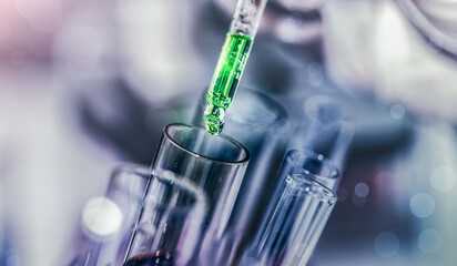 scientist with equipment and science experiments laboratory glassware containing chemical liquid. Health care researchers working in life science laboratory analyzing microscope slides in research lab