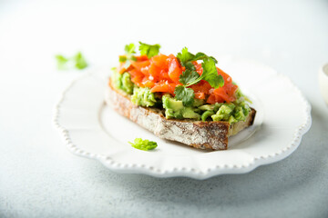 Fototapeta na wymiar Healthy avocado toast with salmon