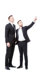 Just look at this! Full length of two happy young businessmen pointing copy space and smiling while standing isolated on white
