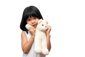 Portrait of happy and funny Asian child girl on white background, a child looking at camera. Preschool kid dreaming fill with energy feeling healthy and good concept