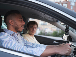 UK, South Yorkshire, Smiling gay couple in car