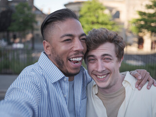 UK, South Yorkshire, Portrait of smiling gay couple embracing outdoors