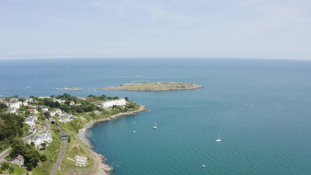 Flying towards The Dalkey Island with the view of 7 Eire, yachts and a blue sea on a beautiful day, Ireland