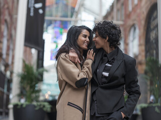 Female couple walking in street