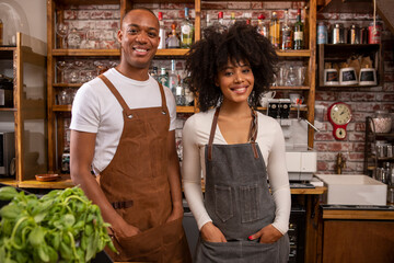 UK, London, Portrait of smiling cafe owners