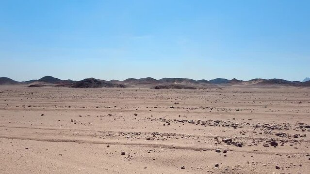 Driving SUV in the hot Egyptian desert POV. Main tourist attraction for people visiting and traveling to Egypt