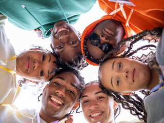 Group of teenage (16-17) looking at camera, view from below