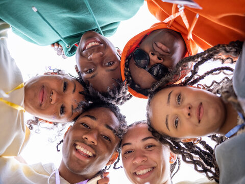 Group of teenage (16-17) looking at camera, view from below