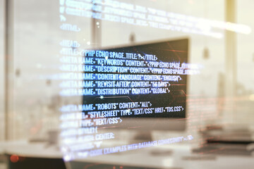 Double exposure of abstract programming language on laptop background, research and development concept